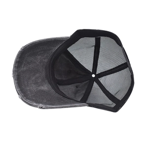 Detail of distressed mesh trucker hat with frayed edges and breathable net structure