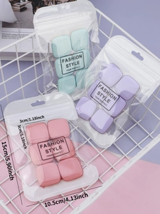 Detailed view of colorful square finger powder puffs in professional frosted packaging