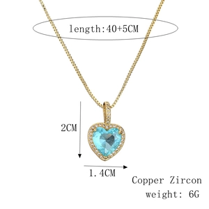 Detail of blue zircon heart pendant showing size 2cm and gold chain length dimensions