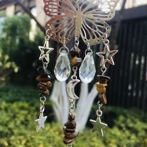Detailed suncatcher view with silver butterfly, crystal beads, and tiger eye stones