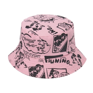 Detailed view of pink canvas bucket hat with black all-over comic style character print