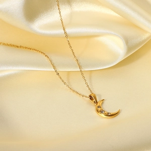 18K gold stainless steel moon pendant necklace with three cubic zirconia stones on silk