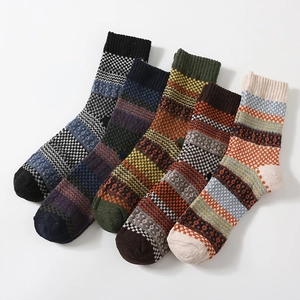 Five pairs of men's vintage thick wool socks with ethnic mosaic and stripe patterns