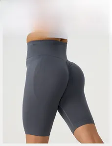 Detail of high-waist seamless scrunch yoga shorts in dark grey with elastic band
