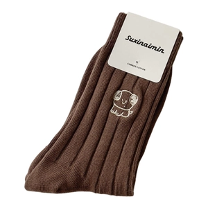 Brown combed cotton crew socks with puppy embroidery and ribbed texture on white background