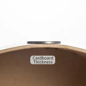 Eco-friendly round kraft paper gift box with a visible thick cardboard cross-section
