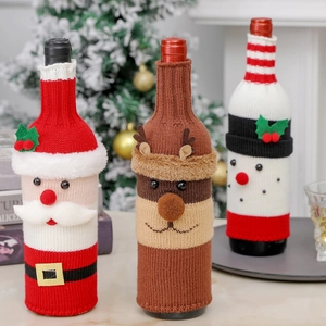Knitted Christmas wine bottle covers featuring Santa, reindeer, and snowman festive designs
