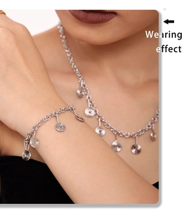 Wearing effect of silver spiral pendant necklace and bracelet set on model closeup
