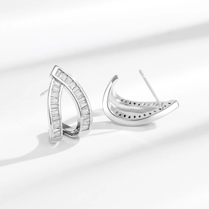 Silver crescent earrings with rectangular clear zircons shown from multiple angles
