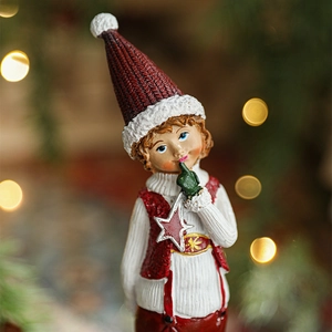 Charming Christmas resin doll ornament featuring a red knit hat boy with warm bokeh background