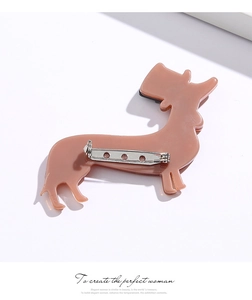 Macro shot of the dachshund acrylic brooch back with secure metal pin closure mechanism