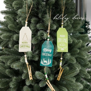 Three-piece set of wooden Christmas tree hanging tags with snowflakes, deer and twine