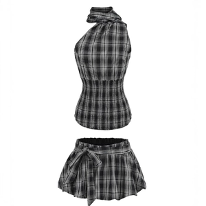 Plaid two-piece set featuring a halter neck crop top and pleated mini skirt with bow detail