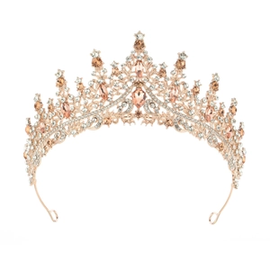 Elegant rose gold crown with pink crystals and rhinestones on a white background