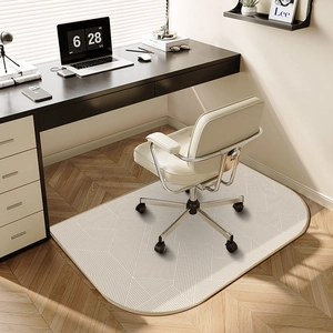 Beige geometric TPR office chair mat with round edges in a modern sunlit study room