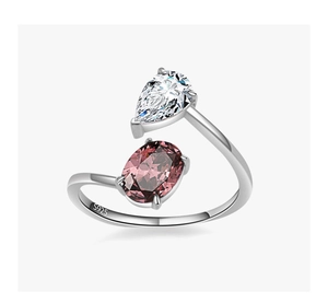 Detail of S925 silver ring featuring pear-cut white zircon and oval pink-purple gemstone