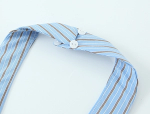 Detail of blue and brown striped halter neck top with three white round buttons