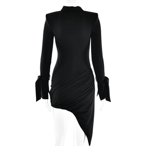 Detail of black long-sleeve dress featuring side ruching and cuff tie accents