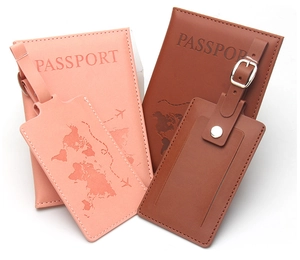 Close-up of PU leather passport cover and luggage tag set with embossed world map design