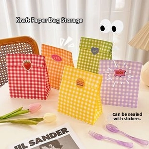 Close-up of colorful checkered kraft paper storage bags with decorative stickers