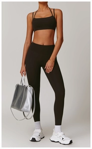 Detail view of high waist dark brown yoga leggings and matching top set for fitness