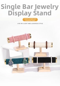 Detailed view of single-bar velvet jewelry stands with wooden bases in multiple colors
