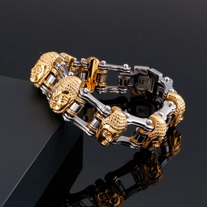 Detail of two-tone stainless steel bracelet with Buddha head charms and mechanical link design