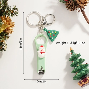 Detail of Christmas nail clipper keychain with cute snowman and small tree pendant