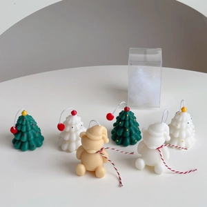 Mini Christmas tree and bear scented candles in elegant plastic gift packaging