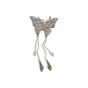 Silver butterfly hair claw clip with rhinestones and tassel charms on white background