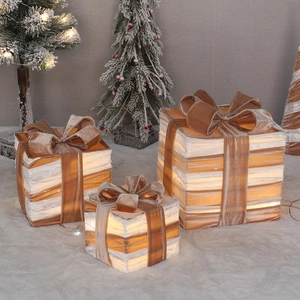 Three-piece glowing white Christmas gift box set with brown velvet ribbons and LED lights