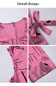 Detail view of pink geometric print jumpsuit with S-size label and waist bow-tie
