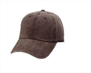 Detailed side view of washed dark brown baseball cap with vintage distressed cotton texture