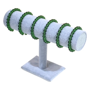 Ice grey T-bar display stand holding green beaded bracelets on a white background