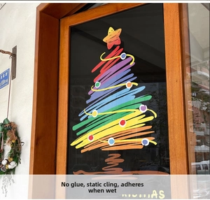 Detail of colorful rainbow Christmas tree window sticker with Merry Christmas text