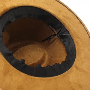 Detail view of the brown wide-brim fedora interior with adjustable ribbon for head size