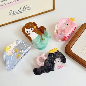 Set of four cute mermaid hair claws in assorted colors made from glossy acetate material