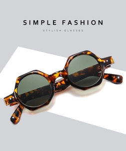Detail view of retro hexagonal tortoise shell sunglasses with silver metal rivet accents