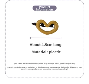 Detailed view of a 4.5cm yellow heart-shaped plastic hair clip with metal duckbill clip