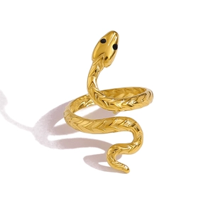 Macro detail of 18K gold plated snake ring showing intricate scale textures and black eyes