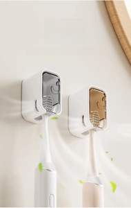 Detail of wall-mounted electric toothbrush holder with ventilation and dustproof cover