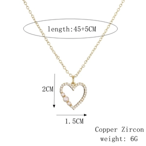Detailed view of golden heart pendant with pearls and cubic zirconia dimensions