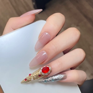 Handmade press-on nails with vintage relief design, pink blush, and sparkling crystals