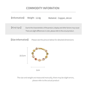 Detailed view of vintage gold-plated bracelet with multi-color zircon stone rings