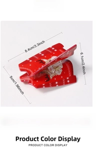 Detailed size view of red Christmas reindeer claw clip measuring 8.4x6.1x5cm
