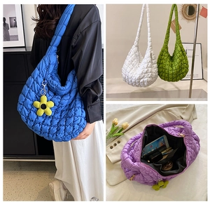 Detail view of large quilted bubble bags in multiple colors with spacious interior storage