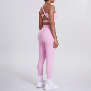 Detailed back view of pink one-shoulder sports bra and high-waist yoga leggings set