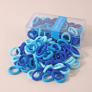 Close-up of blue elastic hair ties in a transparent box with Super Elasticity label