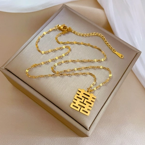 Detail view of gold titanium steel necklace with Xi character pendant and S925 hallmark