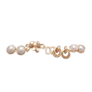 10-piece set of gold flower and pearl stud earrings for women on white background